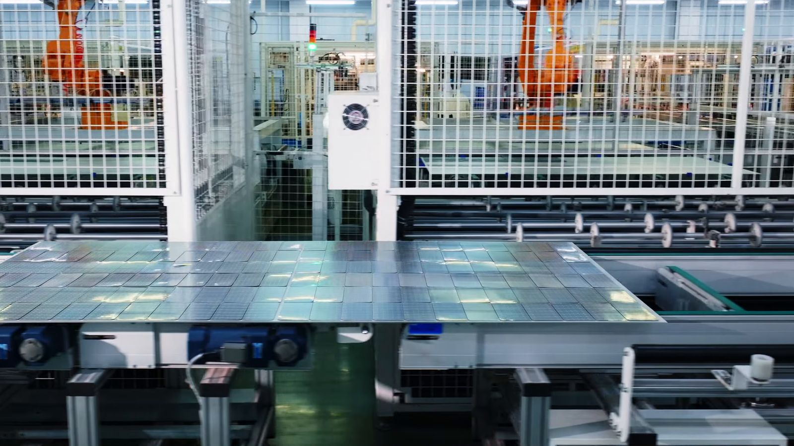 Robot cells along a solar module production line