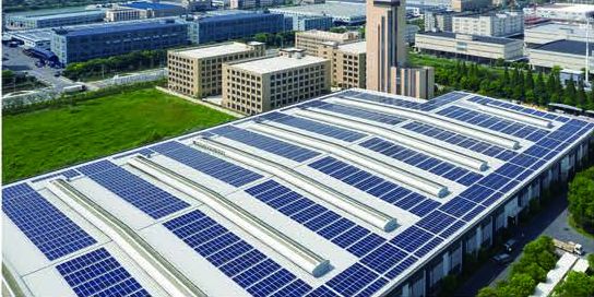 Industrial buildings with solar modules on their roofs
